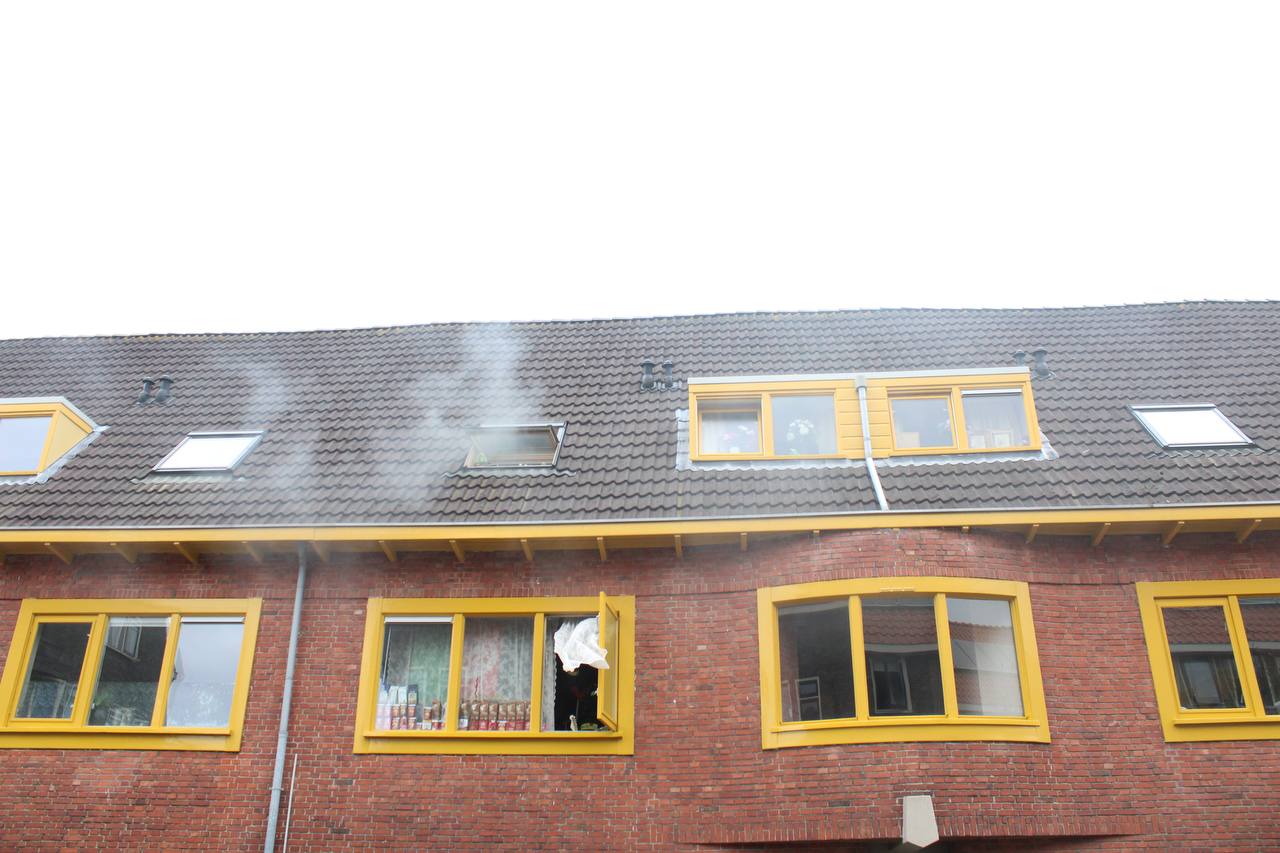 Woning vol rook bij brand in Groningen